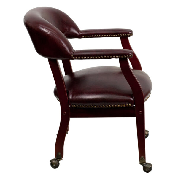 Lowest Price Oxblood Vinyl Luxurious Conference Chair with Accent Nail Trim and Casters