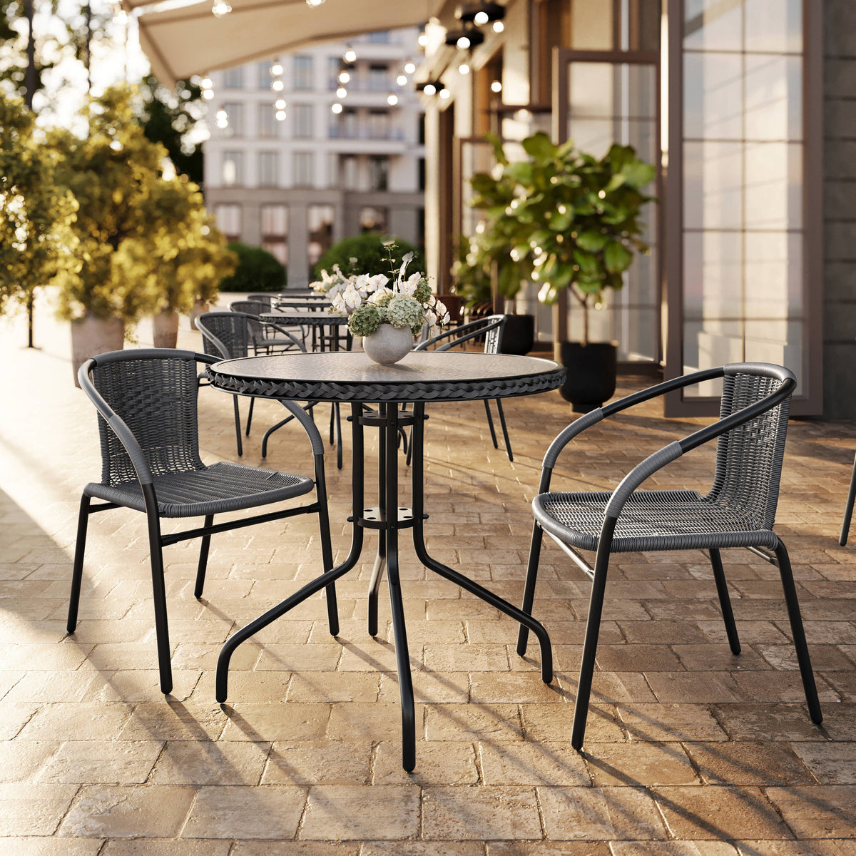 28'' Round Glass Metal Table with Rattan Edging and 2 Rattan Stack Chairs - Image 2